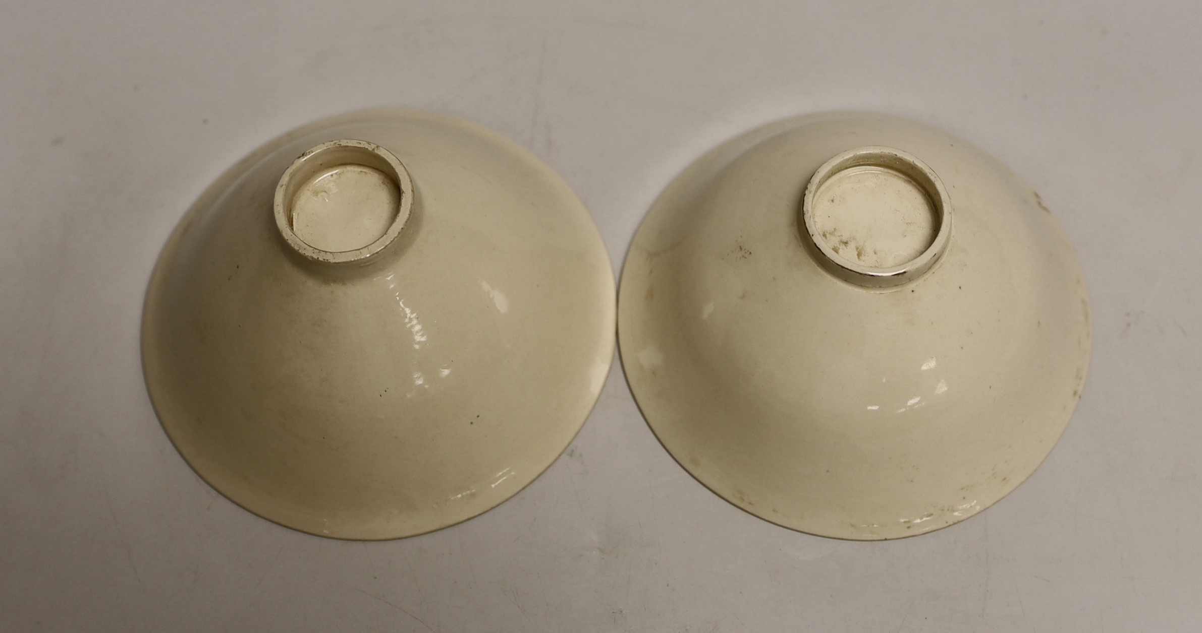 A pair of Chinese Ding type relief moulded bowls, 12cm in diameter